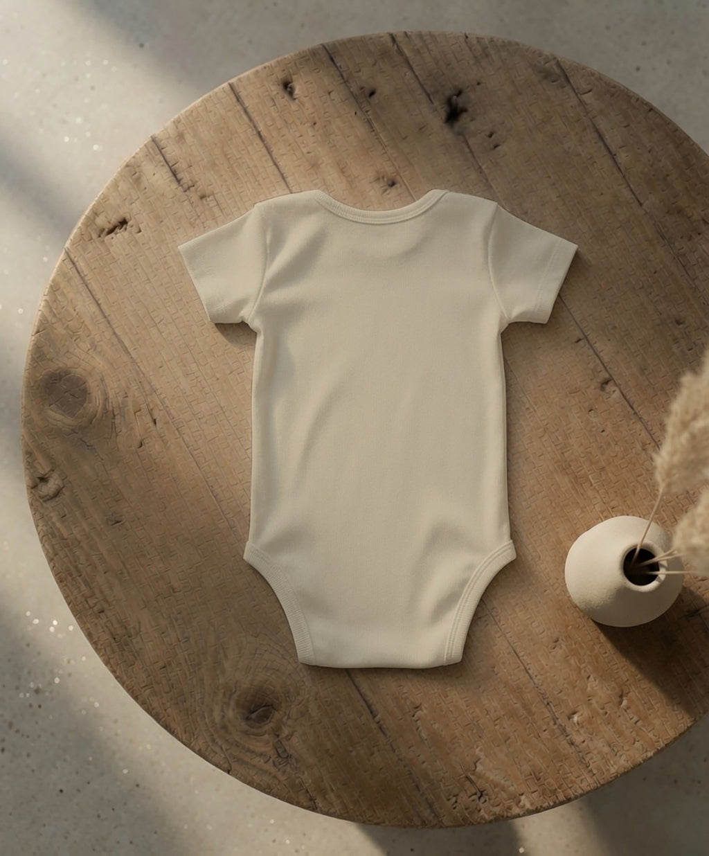 Baby Essential Bodysuit | Black Cockatoo Feather Design