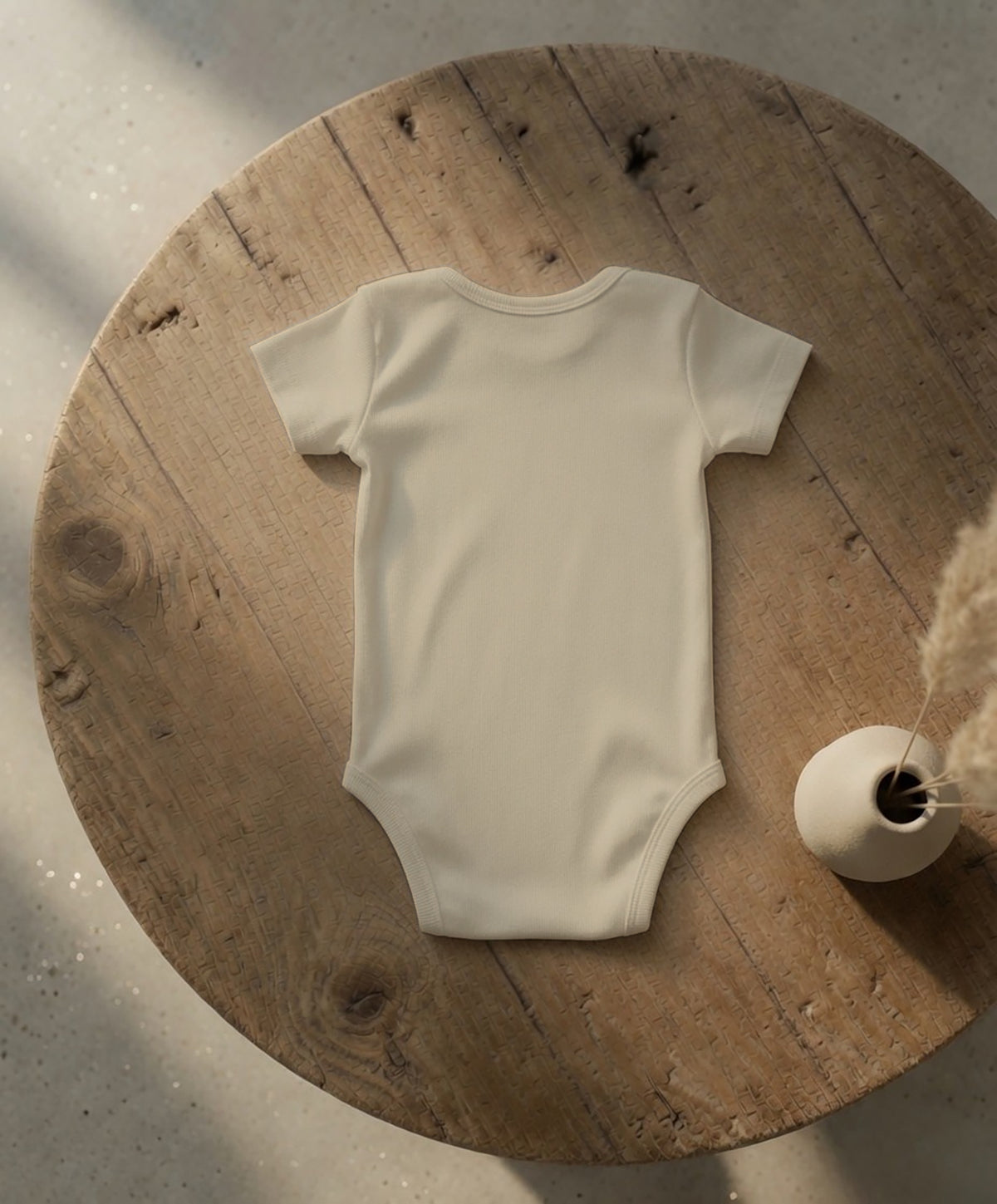 Baby Essential Bodysuit | Black Cockatoo Feather Design